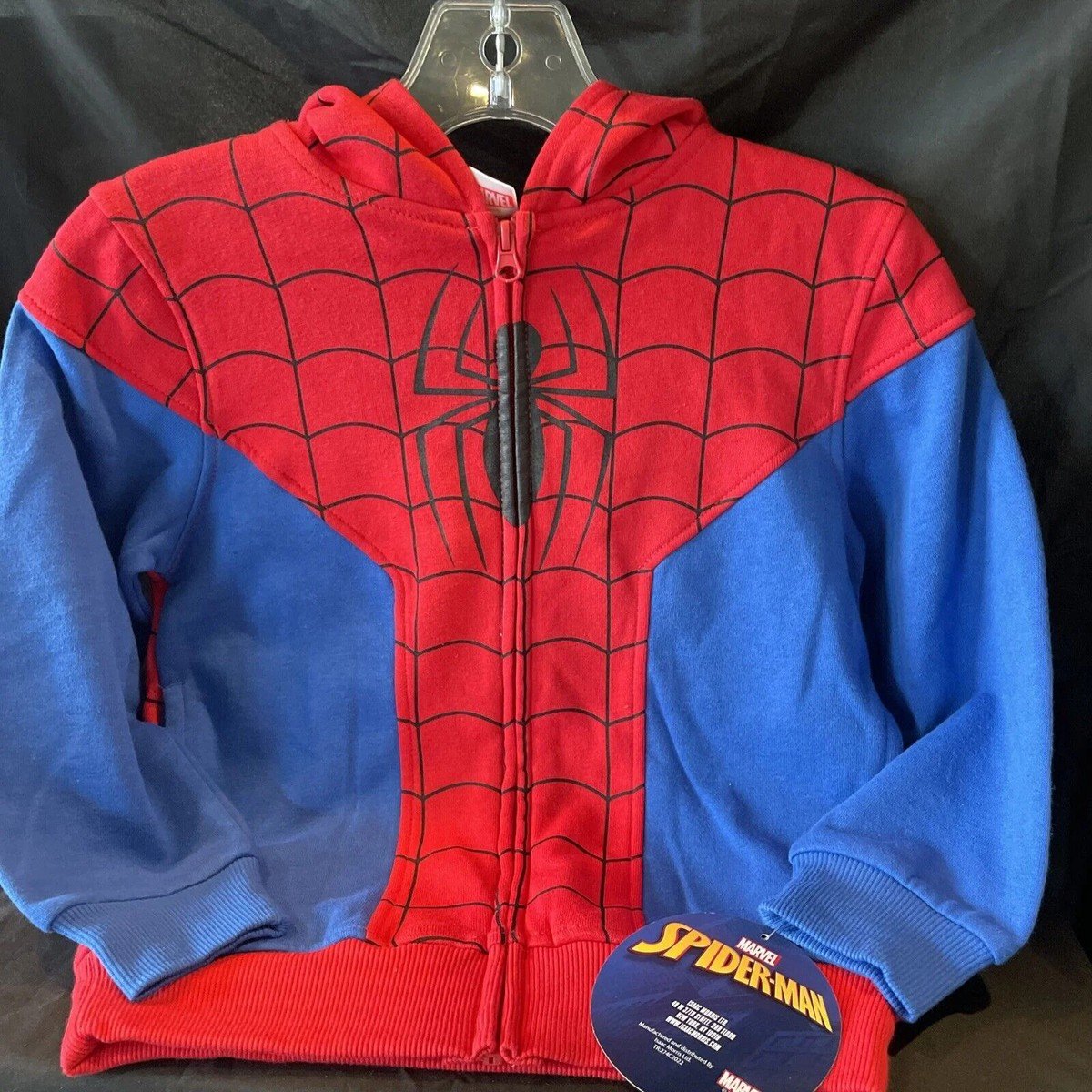 Red and blue Spider-Man zip up hoodie featuring web design pattern and superhero-inspired style for Marvel fans.